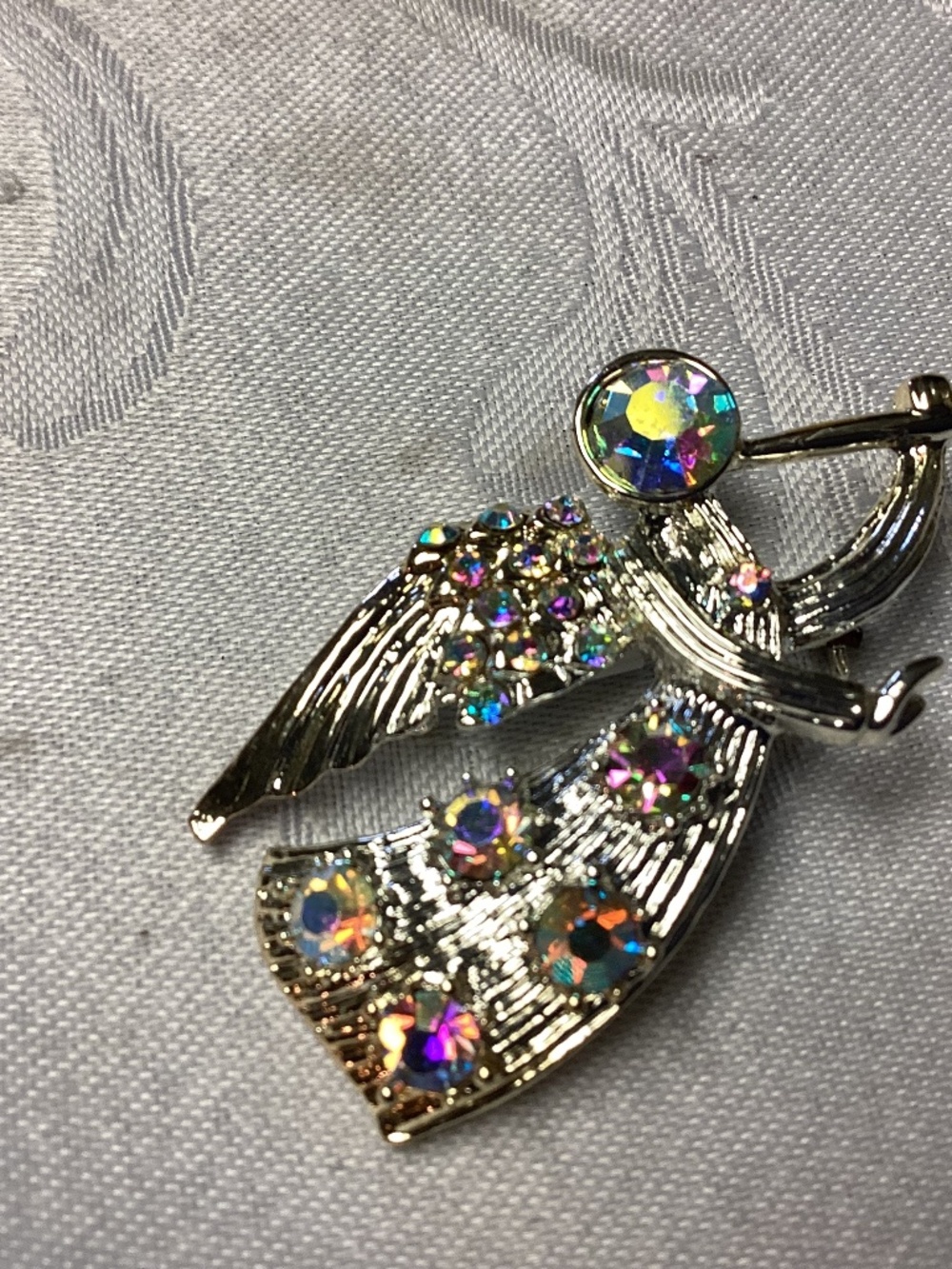 Angel with horn scatter pin. Rhinestones too circa 1950 to 60s